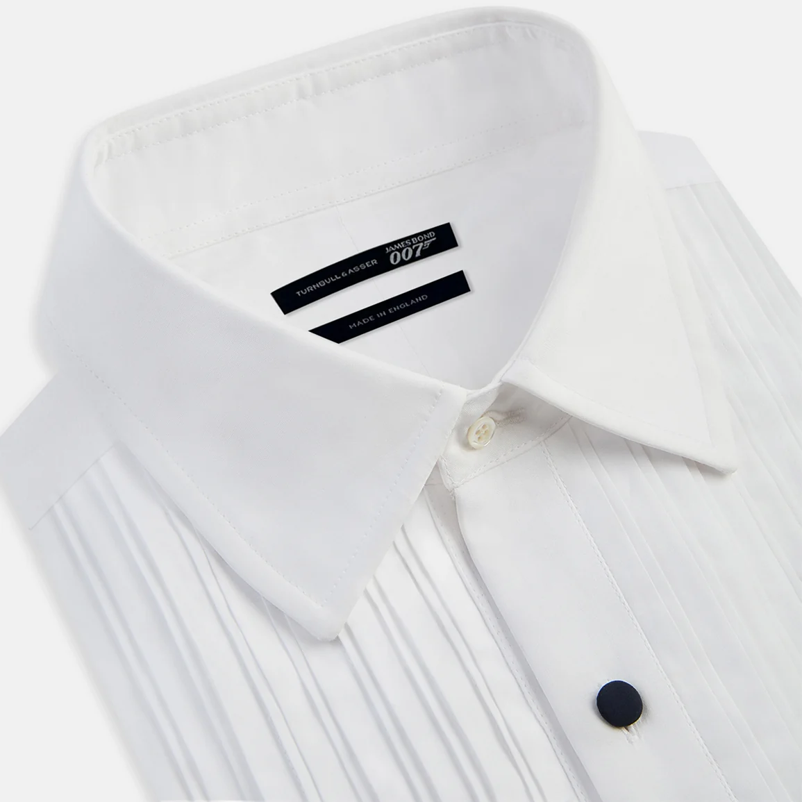 White pleated dress shirt with dark buttons
